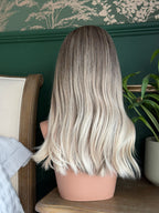 Diana  18 inch long remy human hair wig featuring naturlal looking lace front and multi directional parting lace top.